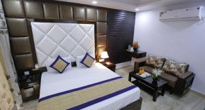 Postel nebo postele na pokoji v ubytování Hotel Delhi Pride, Karol Bagh
