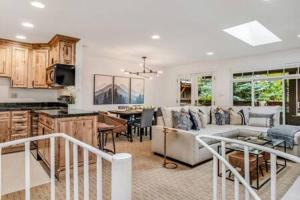 a living room with a couch and a table at New Listing 3BR 3BA Condo - Steps to Gondola in Aspen