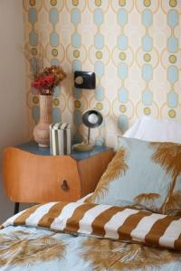 a bedroom with a bed and a table with a lamp at Sancisi 3 in Santarcangelo di Romagna