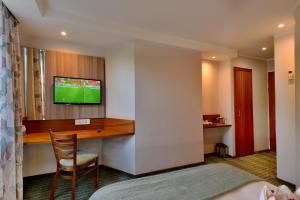 A television and/or entertainment centre at Town Lodge Waterfall, Midrand