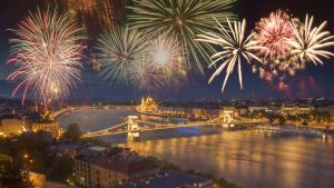a view of a city with fireworks over a river at Riverside luxury panorama home - SmartTV, FastWiFi in Budapest