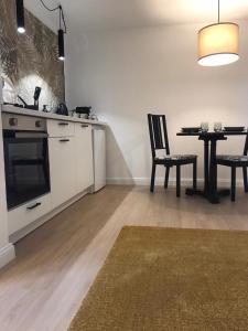 a kitchen with a table and a dining room at Friendly House 94 in Rome