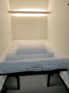 Postel nebo postele na pokoji v ubytování KOZAYO Hongdae Hostel