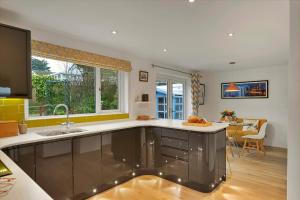 a kitchen with a sink and a counter top at Finest Retreats - Beyond The Blue in Porthleven