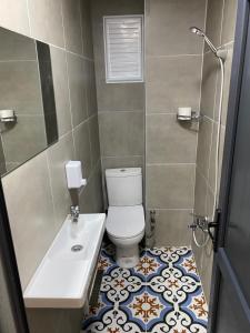 a bathroom with a toilet and a sink at Ferah Otel in Istanbul