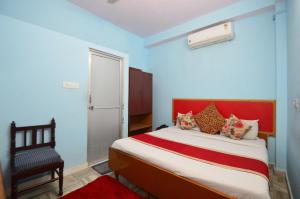 Postel nebo postele na pokoji v ubytování HOTEL JAI MAA PALACE