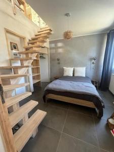 Cama o camas de una habitación en Les Gîtes du Saro