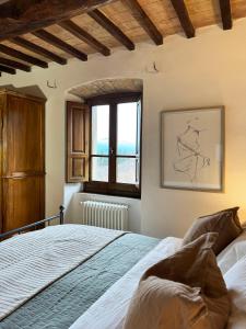 Postel nebo postele na pokoji v ubytování Bio Agriturismo Il Vigno