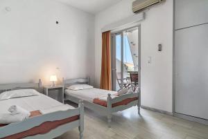 Letto o letti in una camera di Labros Studios