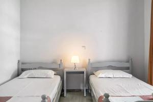 Letto o letti in una camera di Labros Studios
