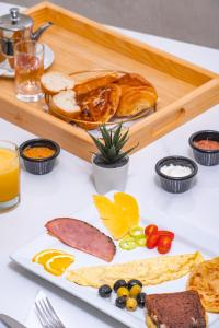 a table with a plate of food on a table at Maarif elite suites in Casablanca