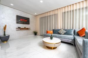 a living room with a couch and a table at Maarif elite suites in Casablanca