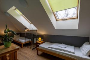 a room with two beds and a window at DREAM Hotel Kyiv in Kyiv
