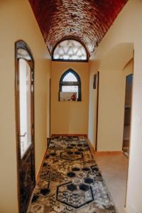 a room with a tile floor and a window at Sun house in Tunis