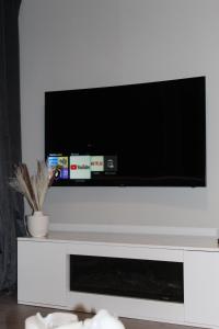 TV i/ili multimedijalni sistem u objektu Stads charme & comfort Tilburg
