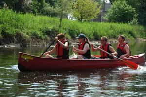 a group of people in a boat on the water at Tipidorf Walbeck in Geldern +3 photos