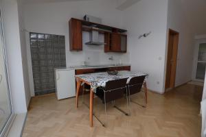 Kuchyň nebo kuchyňský kout v ubytování Apartments Simic