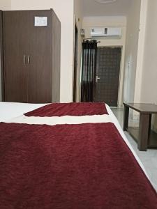מיטה או מיטות בחדר ב-Hotel Atrium Inn