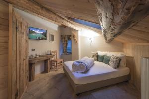 Agriturismo Baita De L'ALL客房内的一张或多张床位
