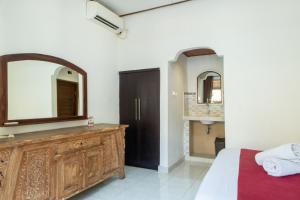 Postel nebo postele na pokoji v ubytování Purnama House