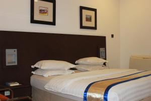 Postel nebo postele na pokoji v ubytování Hotel 5092