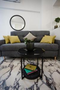 a living room with a couch and a table at AMORE LUXURY APARTMENT in Zagreb