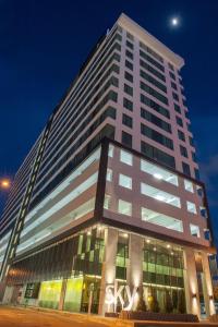 a large white building with a lot of windows at Ber-Santai @Sky Hotel Suites in Kota Kinabalu
