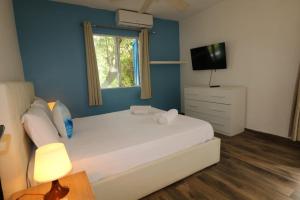 Postel nebo postele na pokoji v ubytování Blue Dream Apartments