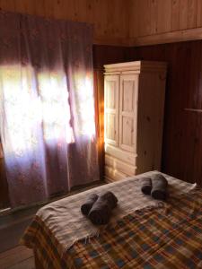 a bedroom with a bed with towels on it at Isla Curubica in Tigre +5 photos