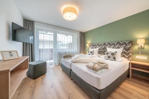 Voodi või voodid majutusasutuse Hotel Falknerhof toas
