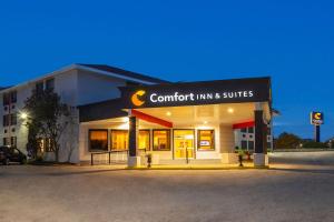 a building with a sign that reads comfort inn and suites at Comfort Inn & Suites Barrie in Barrie