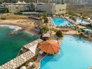 an aerial view of a resort with a swimming pool at Mövenpick Hotel Beirut in Beirut