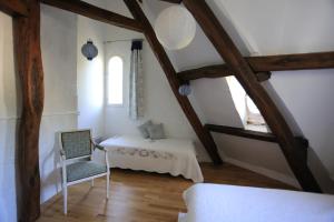 Postelja oz. postelje v sobi nastanitve Maison Dans Le Parc Du Château