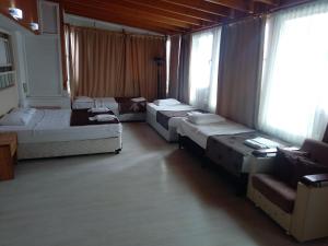 Postel nebo postele na pokoji v ubytování Behram Hotel