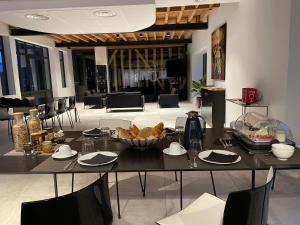 a table with a bowl of food on top of it at L'Atelier De Dégustation in Vertus