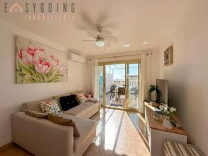 a living room with a couch and a table at Casa Blanca 1 in Santa Pola