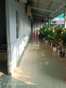 a hallway with potted plants in a building at MOTEL MINH TÂM 28 