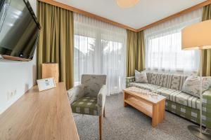 TV a/nebo společenská místnost v ubytování Hotel Falknerhof