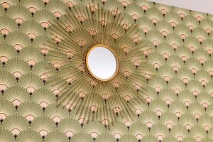 an image of a ceiling with a mirror at Hôtel de Lion sur Mer in Lion-sur-Mer