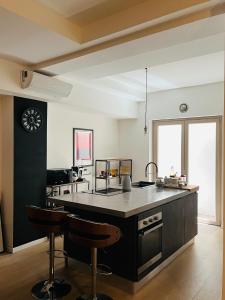 a kitchen with a large island in the middle at Loft Trastevere station in Rome