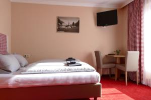 Postel nebo postele na pokoji v ubytování Pension DORFPLATZL Pitztal
