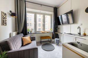 Televízia a/alebo spoločenská miestnosť v ubytovaní Luxury Apartments in the City Center
