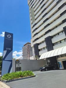 a car is parked in front of a building at Transamerica Executive Nova Paulista in São Paulo