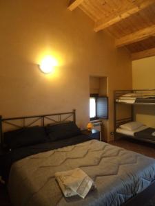 Tempat tidur dalam kamar di B&B Masseria Majella