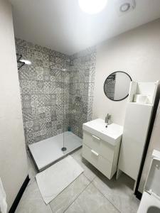 a bathroom with a sink and a shower at Flat 4, Stay in Aldgate in London