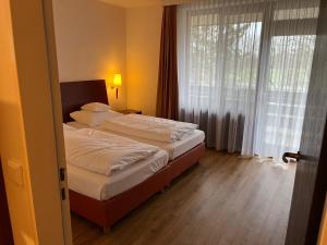 Voodi või voodid majutusasutuse Hotel Heide Kröpke toas