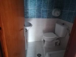 a bathroom with a toilet and a sink at oasis studio in Diafani +23 photos