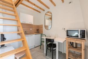 Kuchyňa alebo kuchynka v ubytovaní Emplacement central pour ce studio Vieux Lille