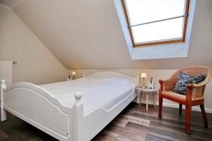 Katil atau katil-katil dalam bilik di Ferienwohnung Papillon Boltenhagen