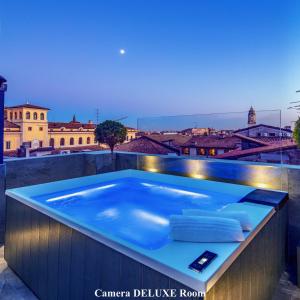 a hot tub on the roof of a building at Forum Suites in Verona